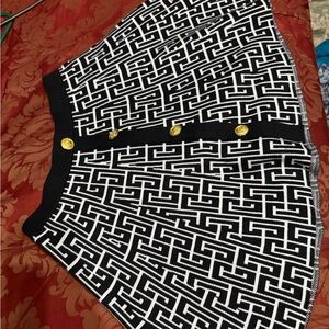 Elegant Geometric Black and White Midi Skirt with Gold Accents